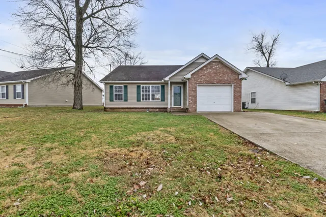 front view of a house with a yard