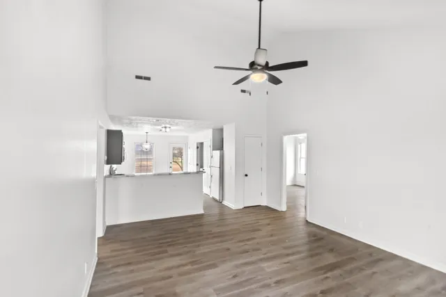 a view of a kitchen with wooden floor