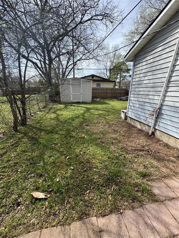 629 Harrison Lane Hurst, TX 76053 - Photo 17 of 20 a view of a backyard with large trees