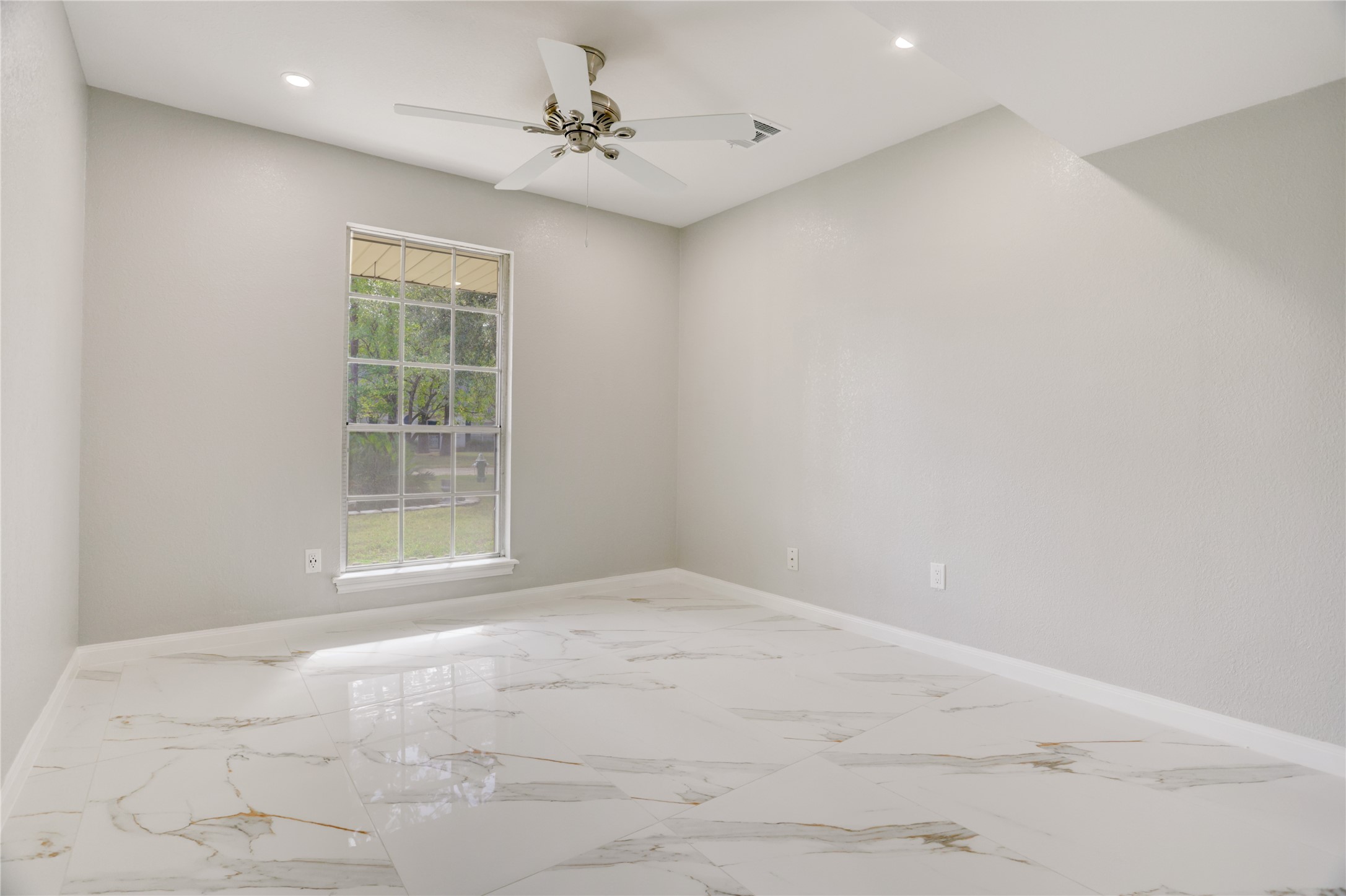 6502 Cypress Point Drive Houston, TX 77069 - Photo 16 of 33 Tucked away on the first floor, this cozy secondary bedroom offers a peaceful retreat with soft natural light and plenty of charm.