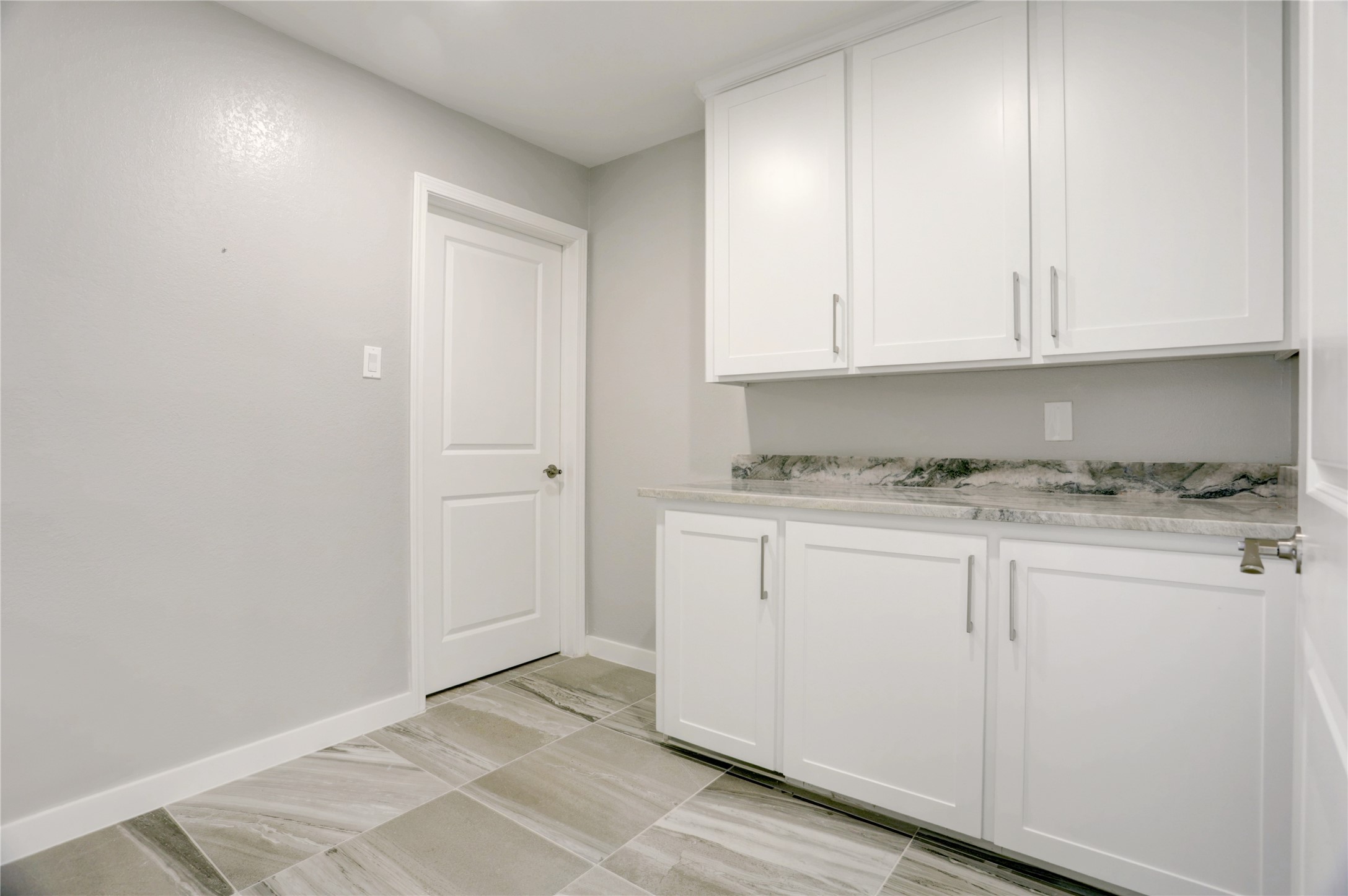 6502 Cypress Point Drive Houston, TX 77069 - Photo 23 of 33 A sleek, well-organized laundry room with crisp white cabinetry, ample counter space, and a pop of charm from an exotic beautiful granite.