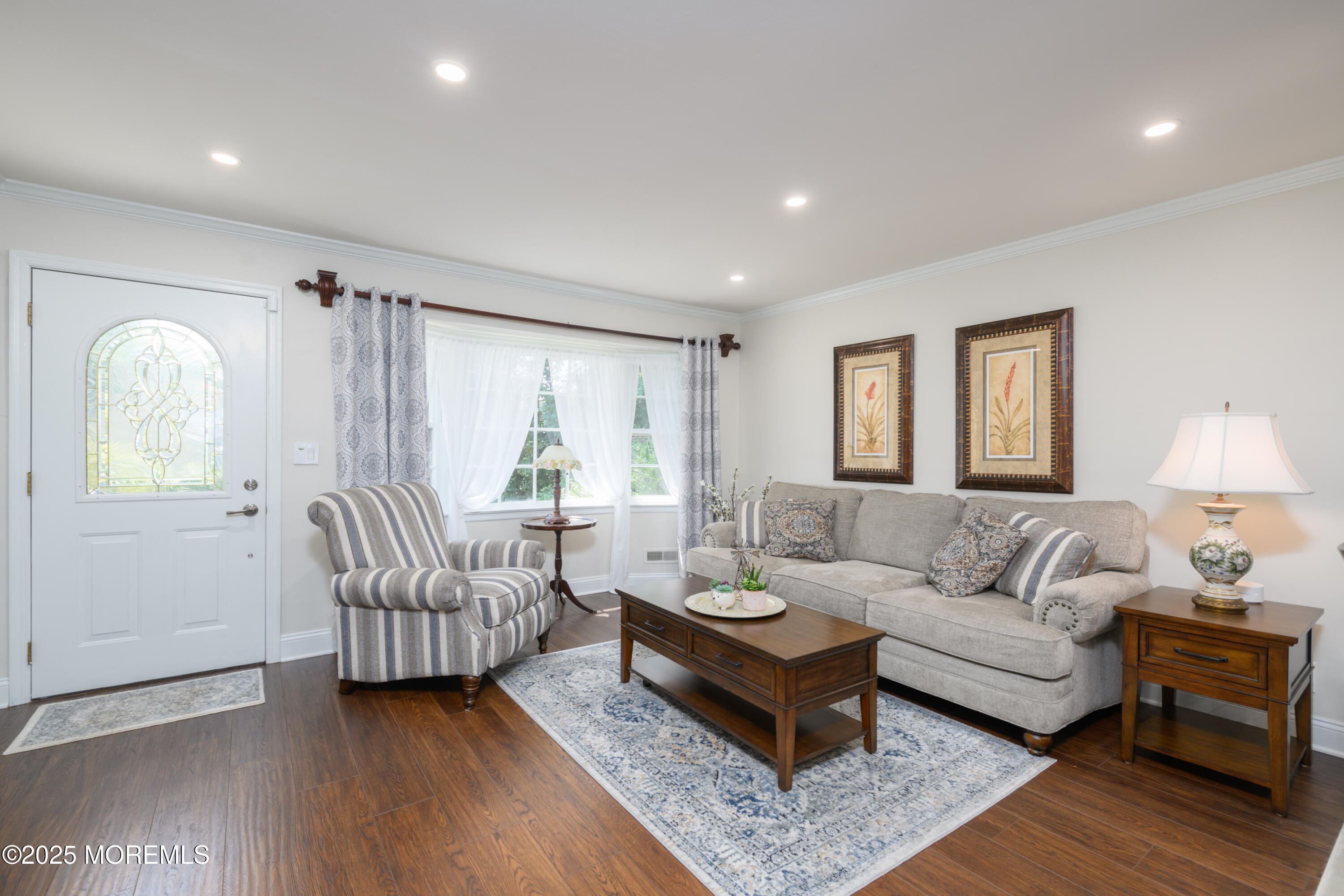 101 Millbrook Place Middletown, NJ 07748 - Photo 11 of 58 a living room with furniture and a wooden floor