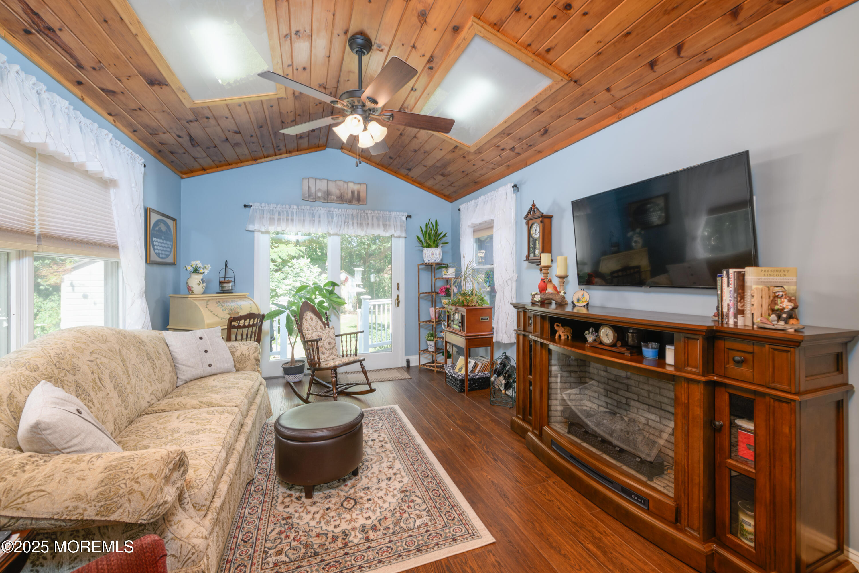 101 Millbrook Place Middletown, NJ 07748 - Photo 20 of 58 a living room with furniture and a flat screen tv