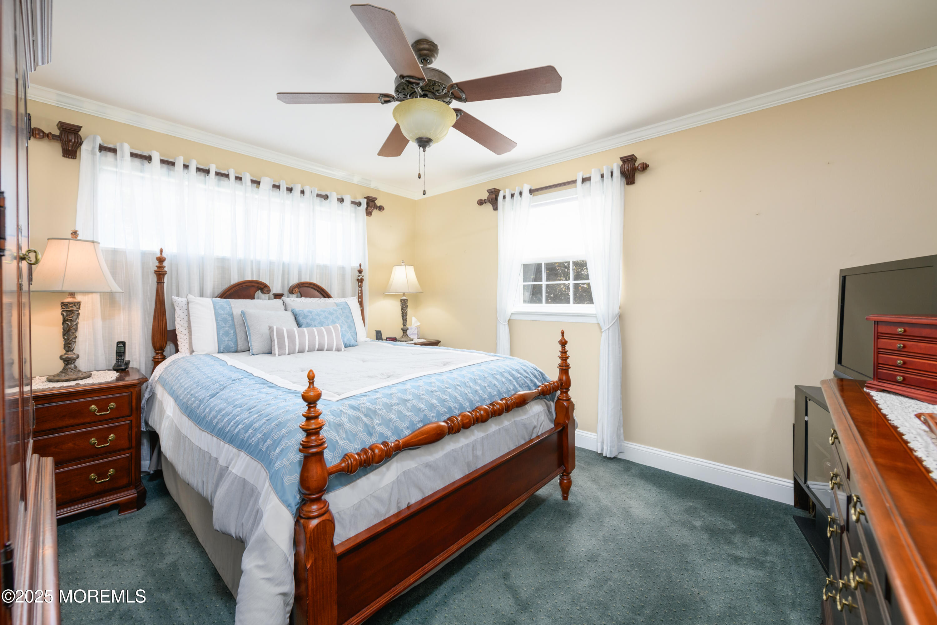 101 Millbrook Place Middletown, NJ 07748 - Photo 27 of 58 a bed sitting in a bedroom next to a window