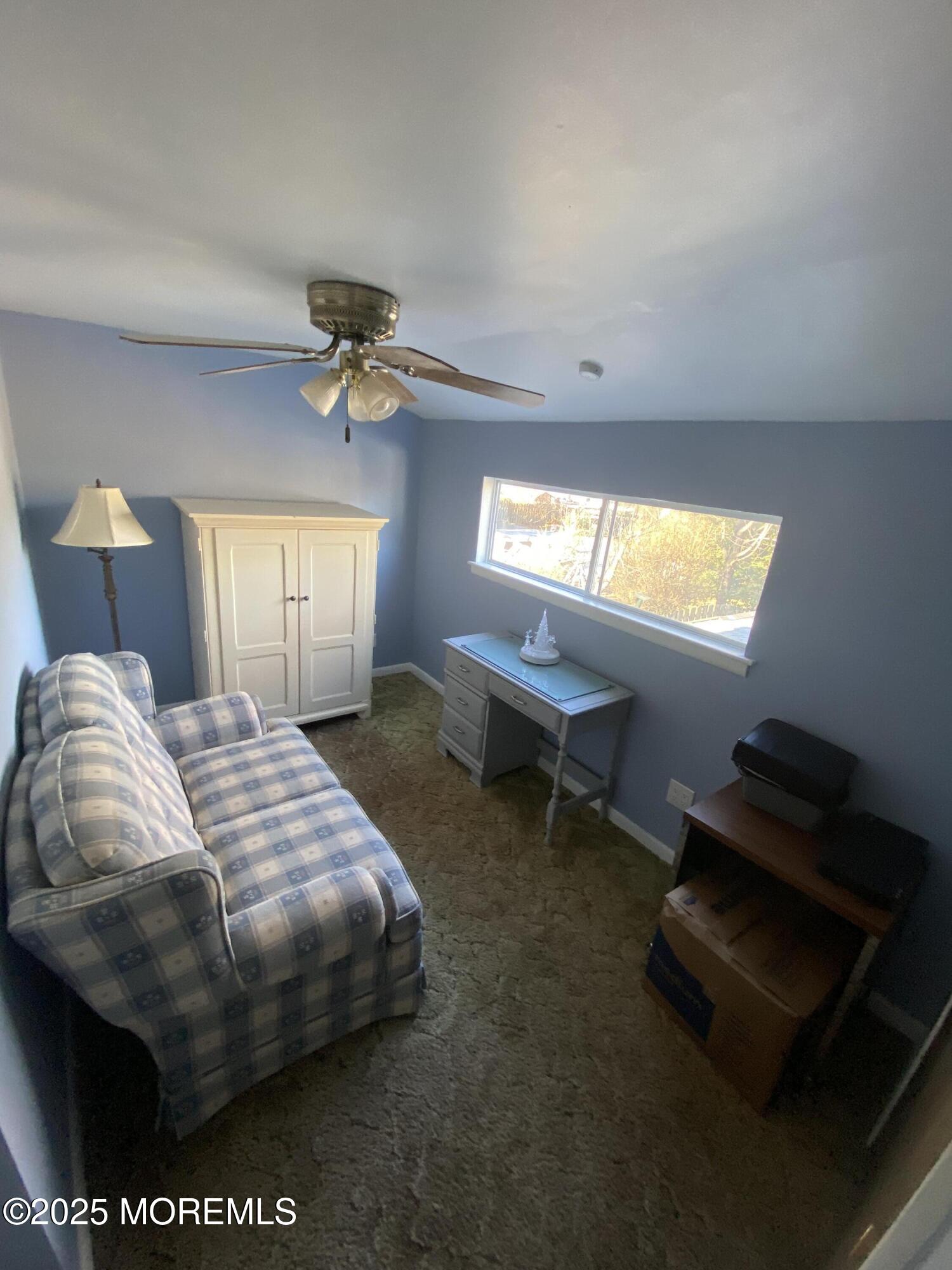 101 Millbrook Place Middletown, NJ 07748 - Photo 33 of 58 a bedroom with a bed and a chandelier