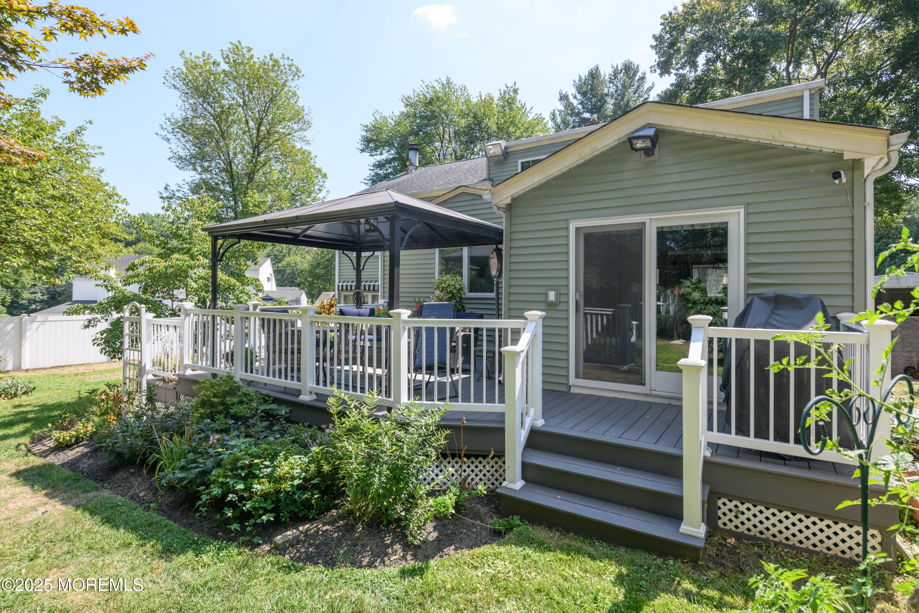 101 Millbrook Place Middletown, NJ 07748 - Photo 41 of 58 a view of a chair and table in backyard of the house