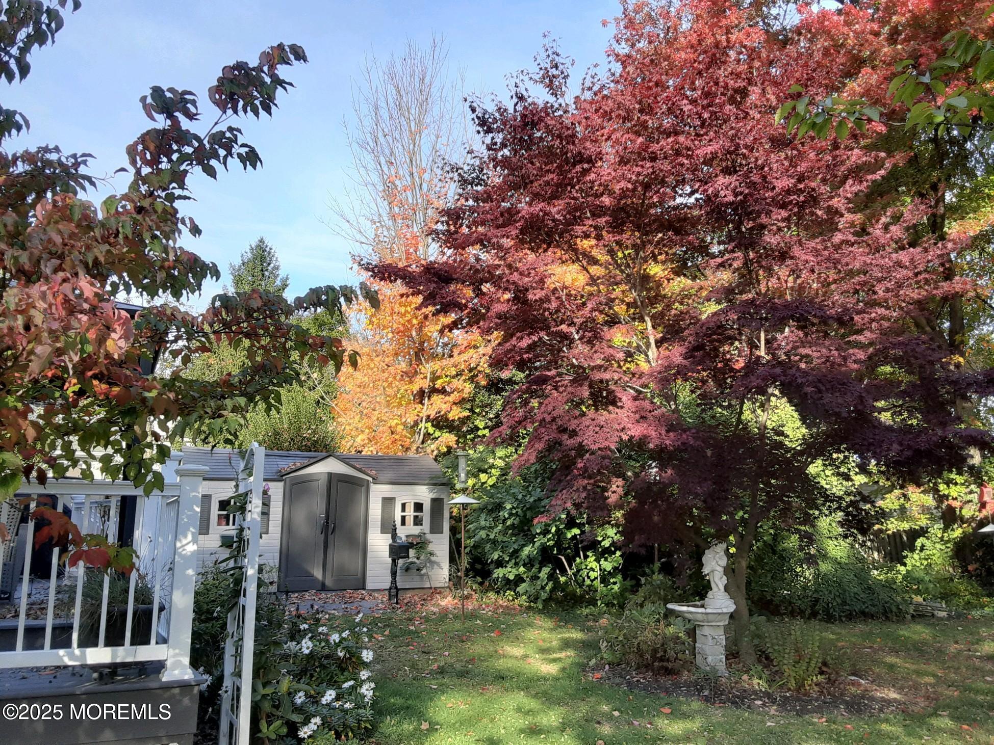 101 Millbrook Place Middletown, NJ 07748 - Photo 49 of 58 a front view of a house with a garden
