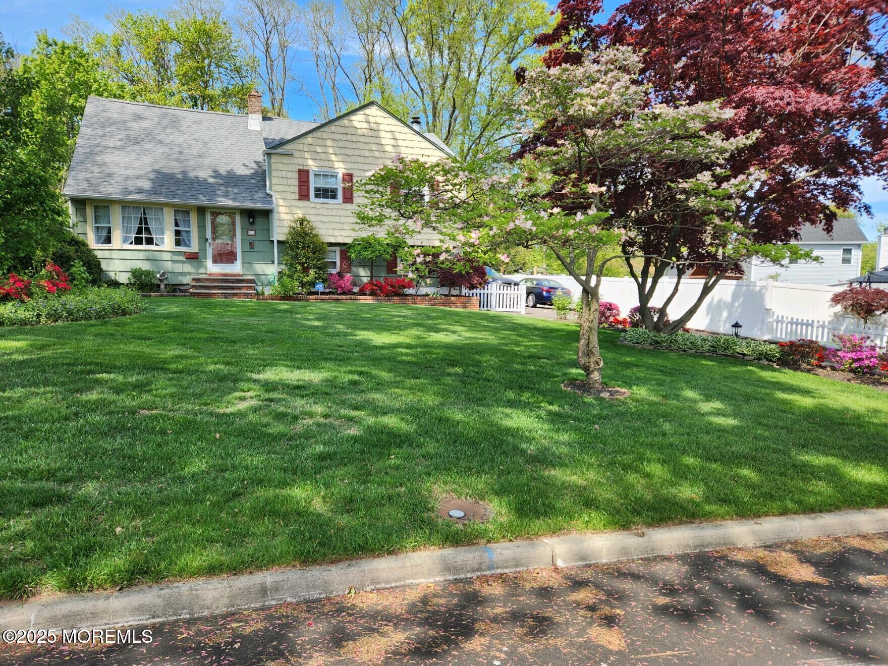 101 Millbrook Place Middletown, NJ 07748 - Photo 5 of 58 a front view of house with yard and green space