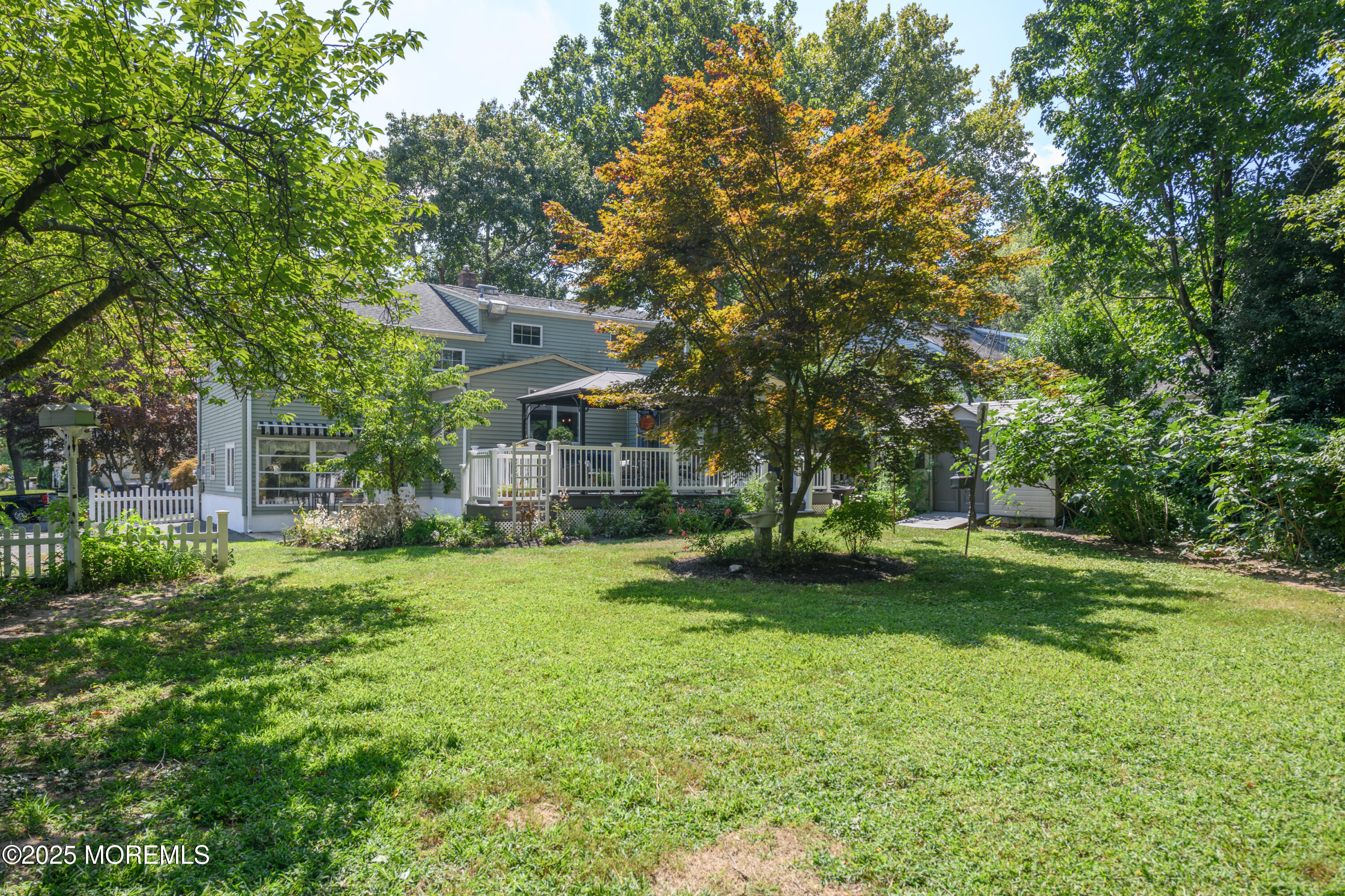 101 Millbrook Place Middletown, NJ 07748 - Photo 52 of 58 a view of a house with a big yard potted plants and large tree