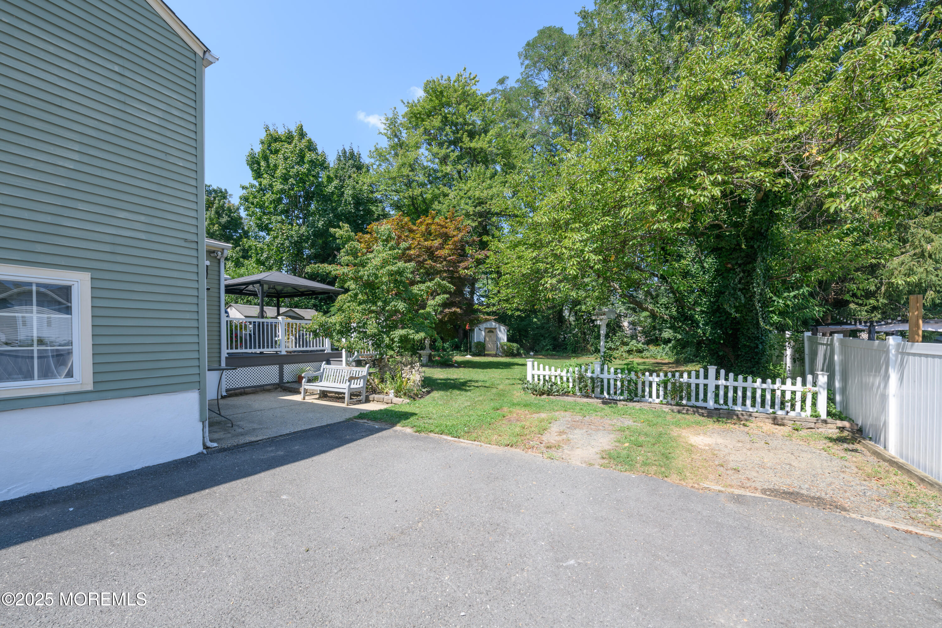 101 Millbrook Place Middletown, NJ 07748 - Photo 53 of 58 a view of a backyard with a garden and trees