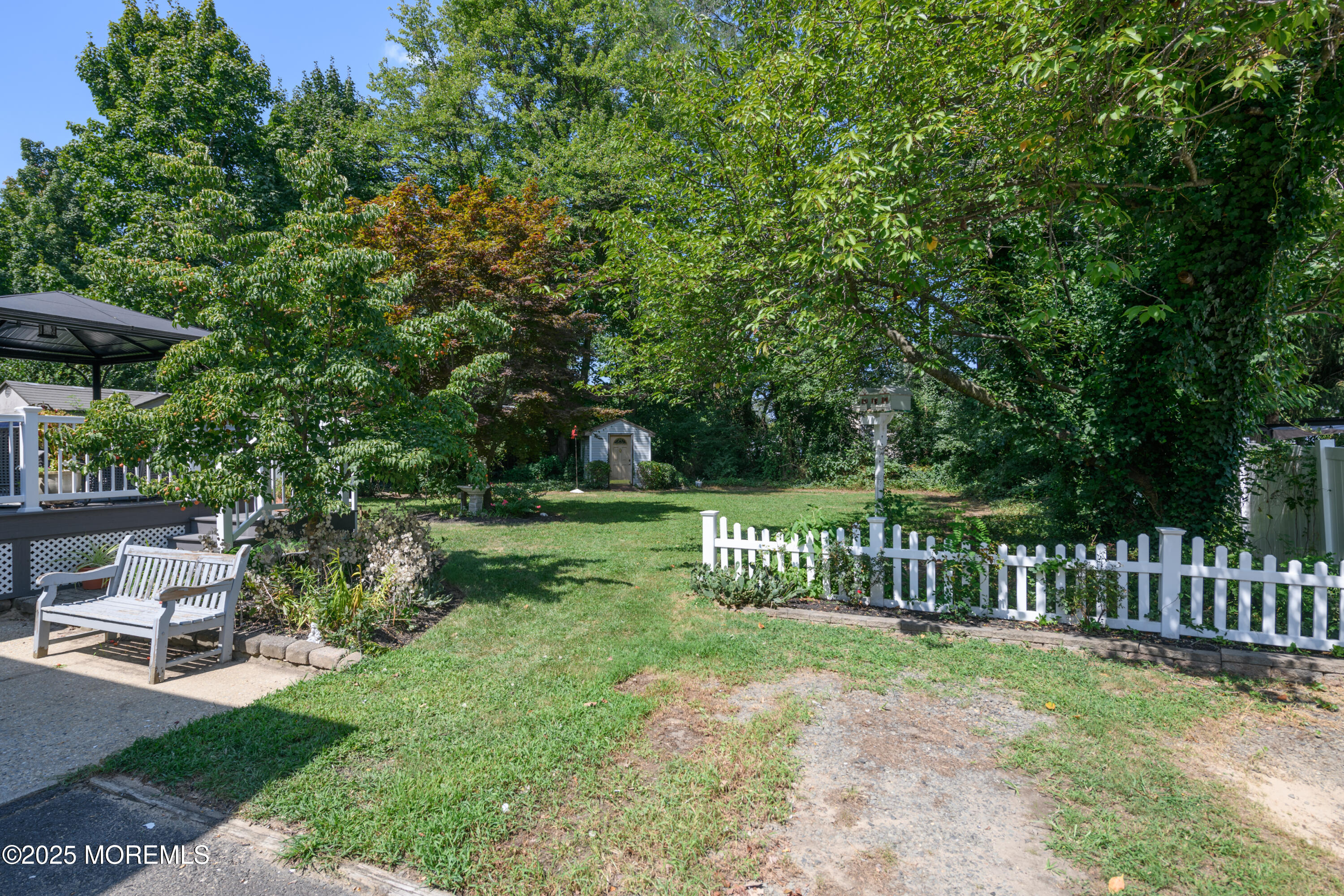 101 Millbrook Place Middletown, NJ 07748 - Photo 56 of 58 a view of a bench in the garden
