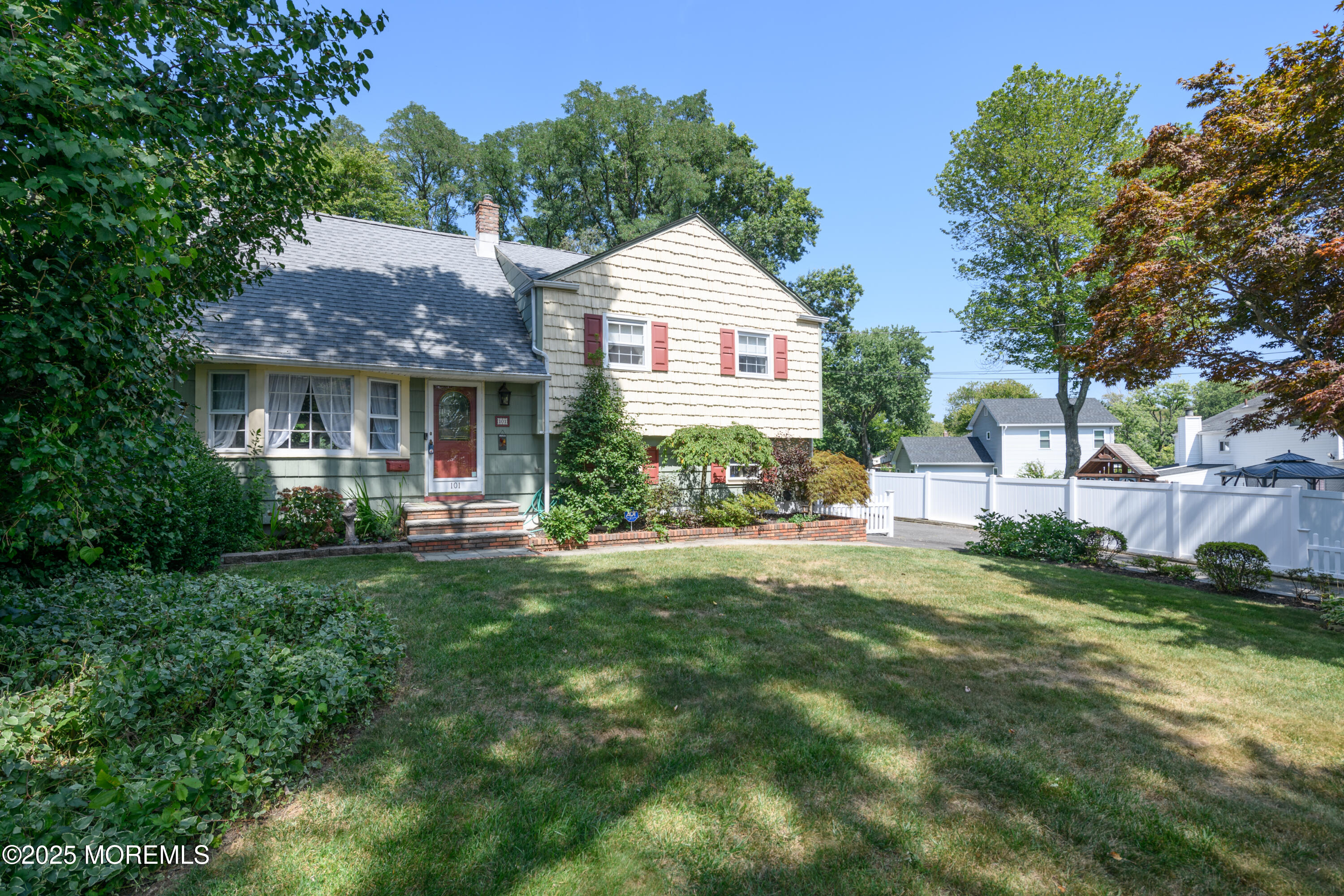 101 Millbrook Place Middletown, NJ 07748 - Photo 6 of 58 a front view of a house with a yard and green space