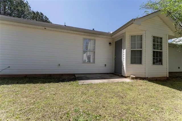a view of a lake with houses in the back