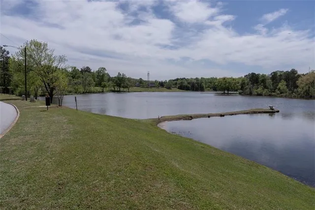 a view of a lake with green space