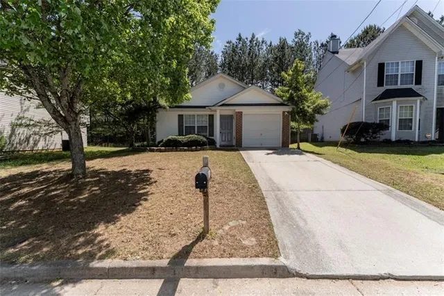 a view of an empty room with a fireplace