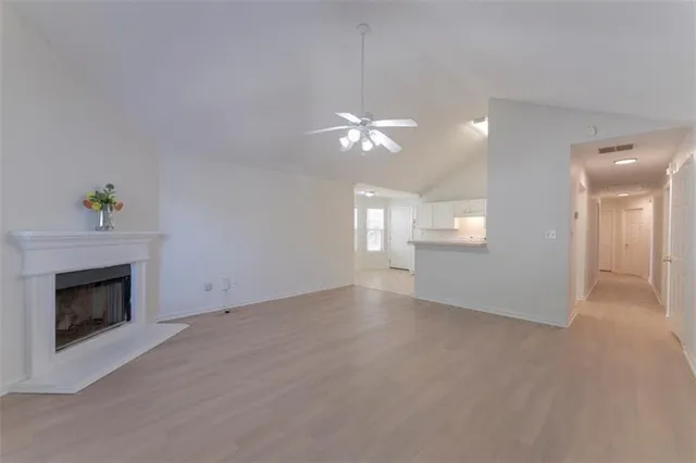 a view of a kitchen with wooden floor