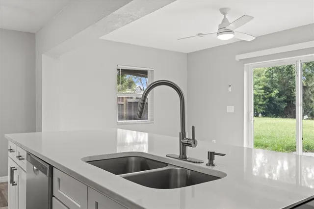 a kitchen with a sink and a window