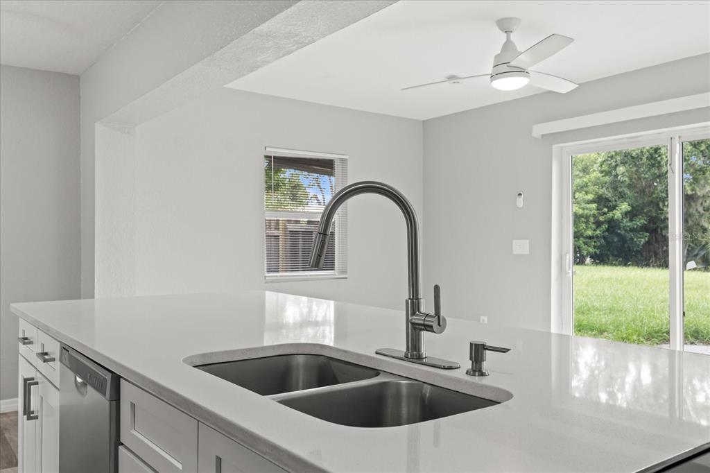 7445 Daggett Terrace New Port Richey, FL 34655 - Photo 15 of 35 a kitchen with a sink and a window
