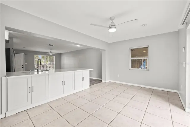 a view of a kitchen with cabinet and window