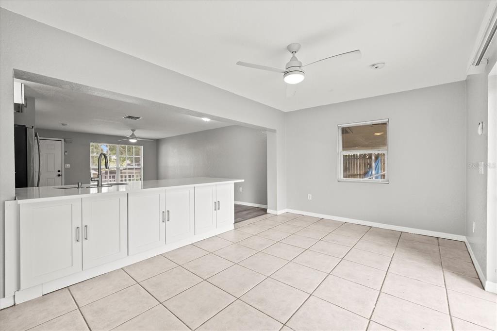 7445 Daggett Terrace New Port Richey, FL 34655 - Photo 16 of 35 a view of a kitchen with cabinet and window