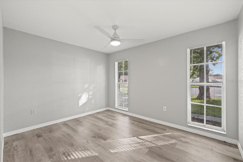 7445 Daggett Terrace New Port Richey, FL 34655 - Photo 21 of 35 an empty room with windows and closet