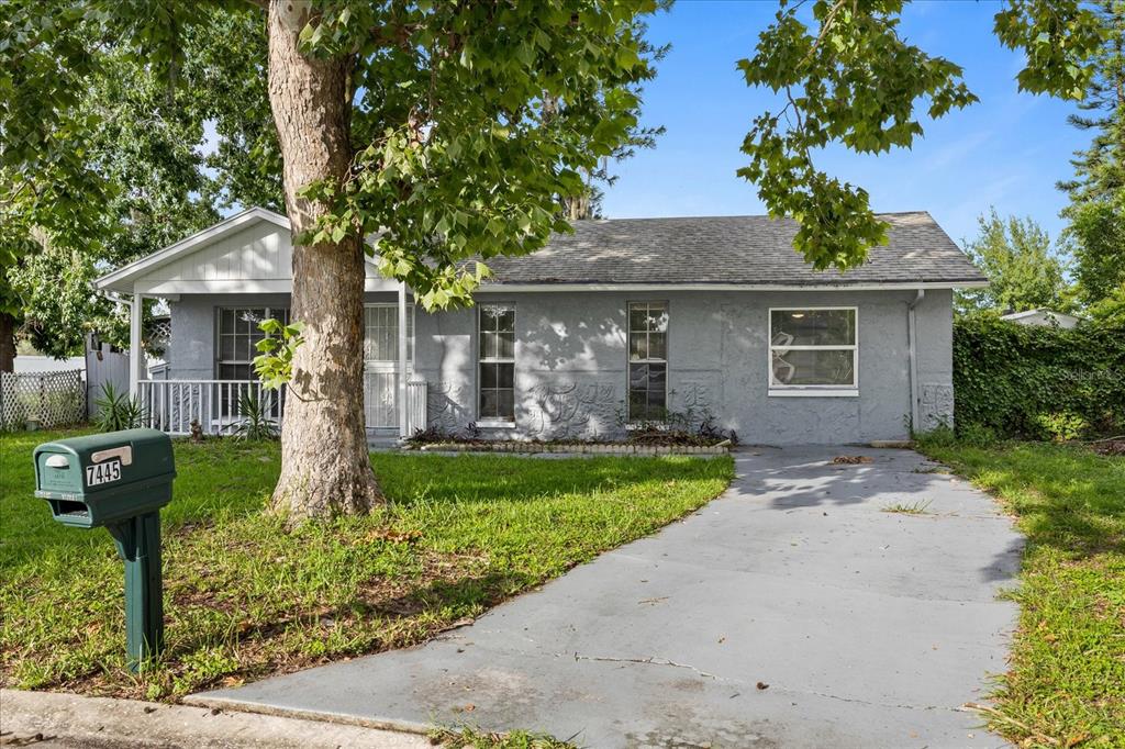 7445 Daggett Terrace New Port Richey, FL 34655 - Photo 31 of 35 a front view of a house with garden