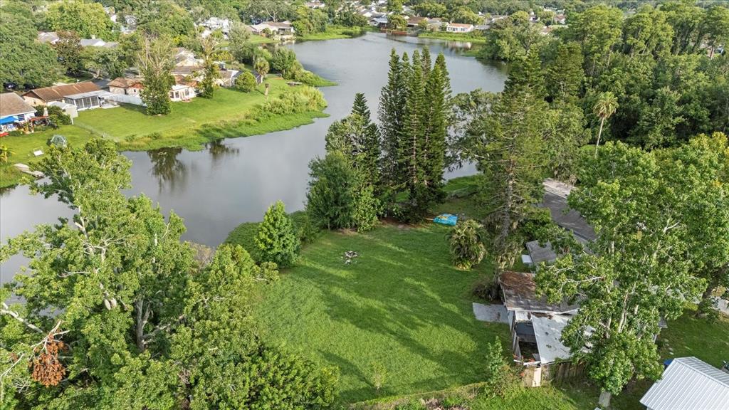 7445 Daggett Terrace New Port Richey, FL 34655 - Photo 32 of 35 an aerial view of residential house with outdoor space and trees all around