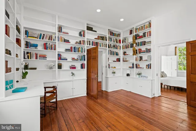 a bedroom with a bed and a fireplace
