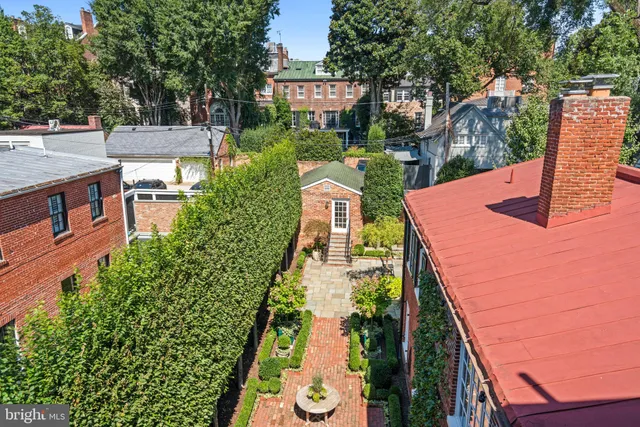a view of a chair and table in backyard