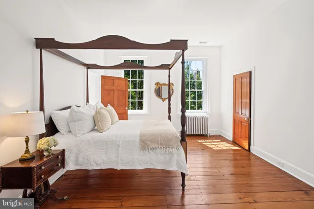 a view of backyard with seating space and trees