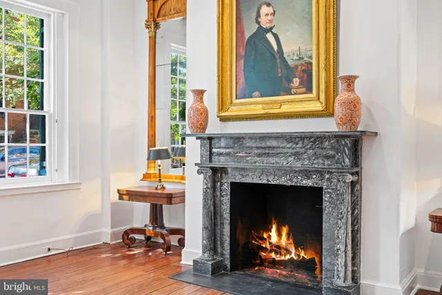 a living room with a fireplace and a window