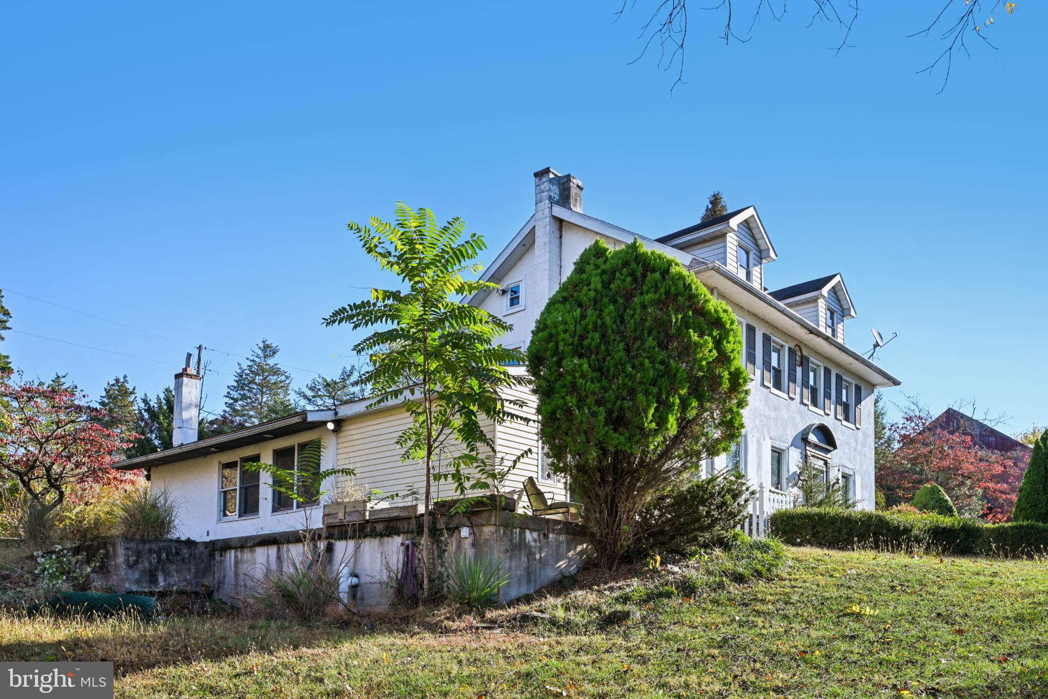 1323 Kepler Road Pottstown, PA 19464 - Photo 6 of 56 Charming hillside home with lush greenery.