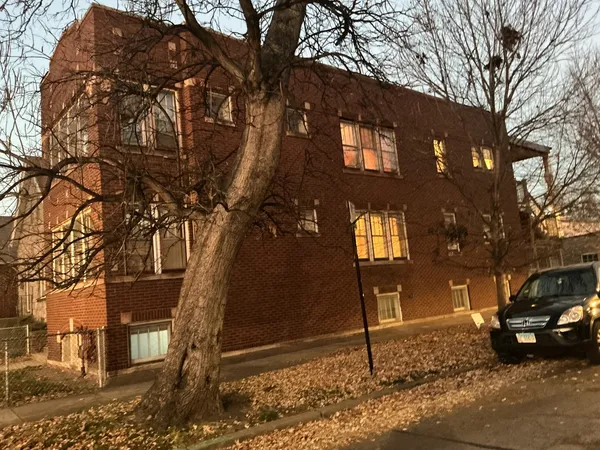 a front view of a house with parking area