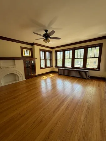 a view of livingroom with hardwood floor and a ceiling fan