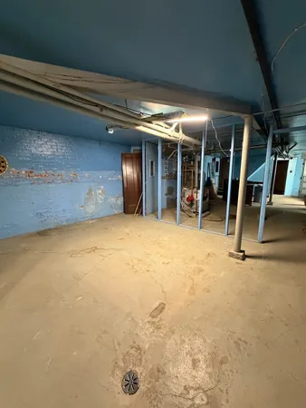 a room with wooden floor and furniture