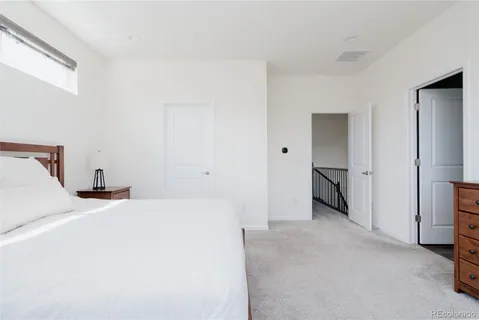 a room with a bed and a view of closet