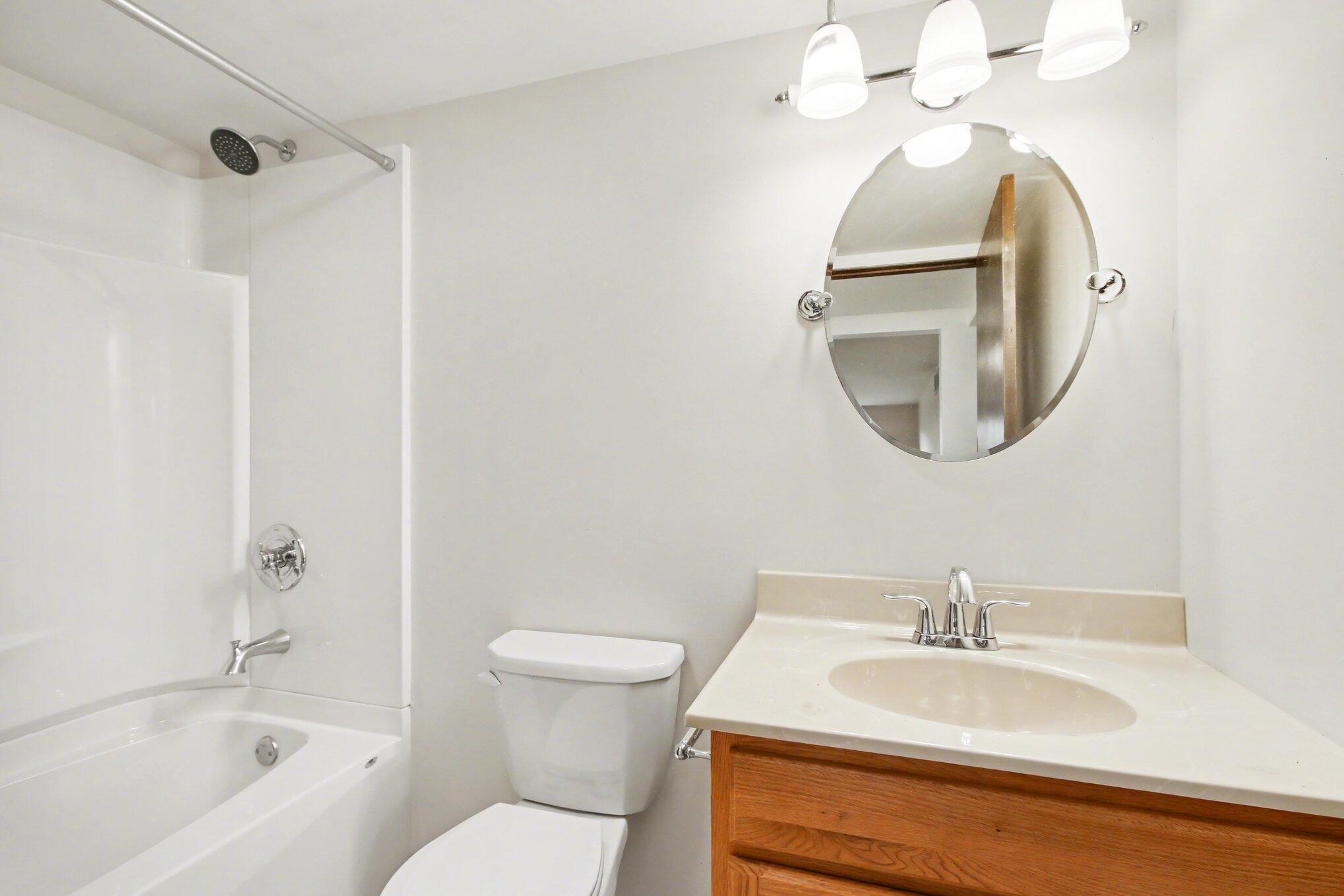 1379 Leeward Road Crown Point, IN 46307 - Photo 27 of 39 a bathroom with a sink a toilet and a mirror