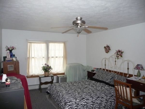 1506 Conant Road Athol, MA 01331 - Photo 8 of 19 a bedroom with a bed dresser and a window