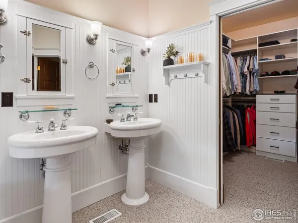 a bathroom with a sink toilet and a mirror