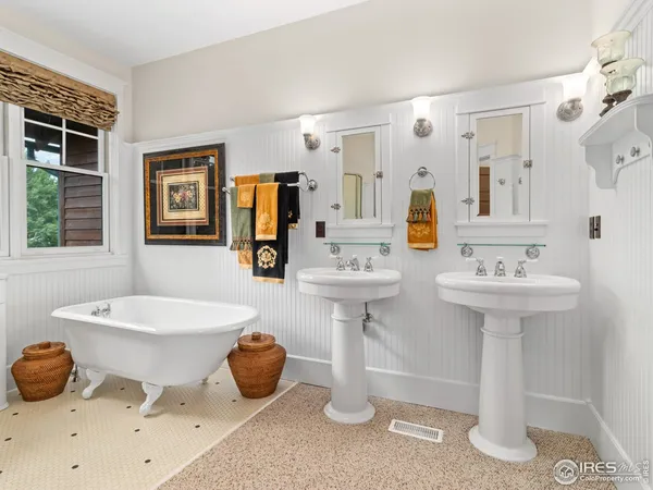 a bathroom with a sink double vanity and a mirror