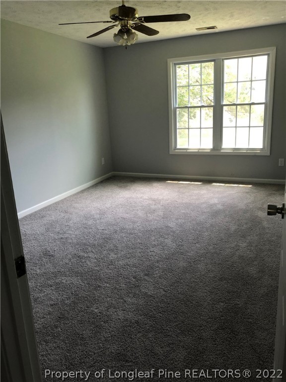 450 Main Street Lillington, NC 27546 - Photo 11 of 11 an empty room with a window