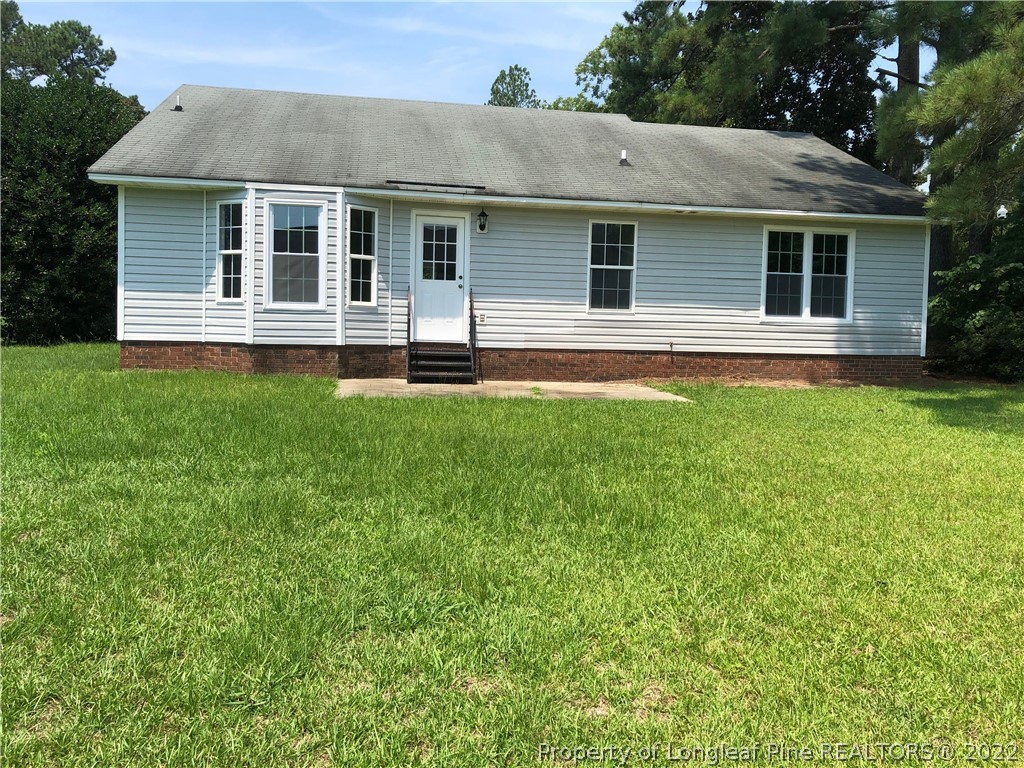 450 Main Street Lillington, NC 27546 - Photo 2 of 11 a front view of a house with a yard