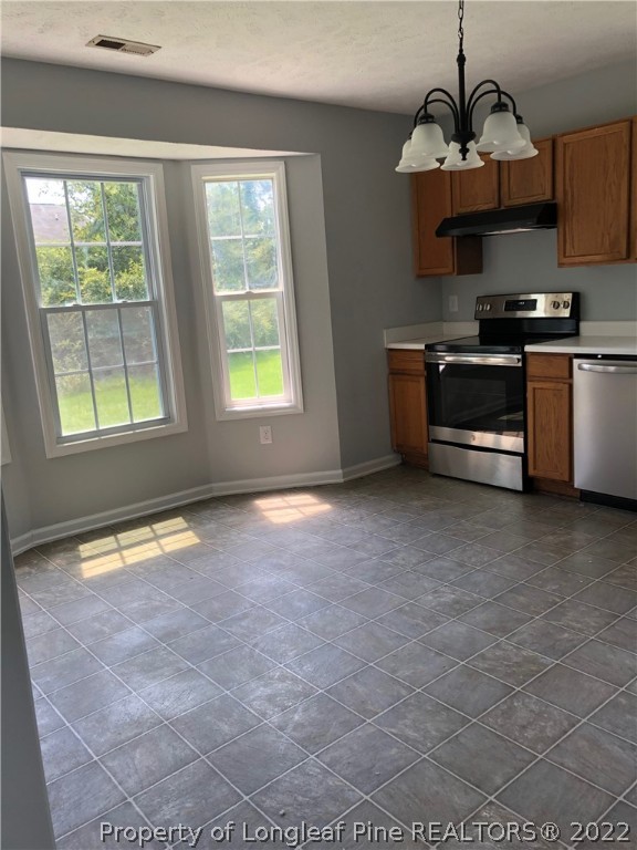 450 Main Street Lillington, NC 27546 - Photo 5 of 11 a view of a kitchen with an empty space and a window
