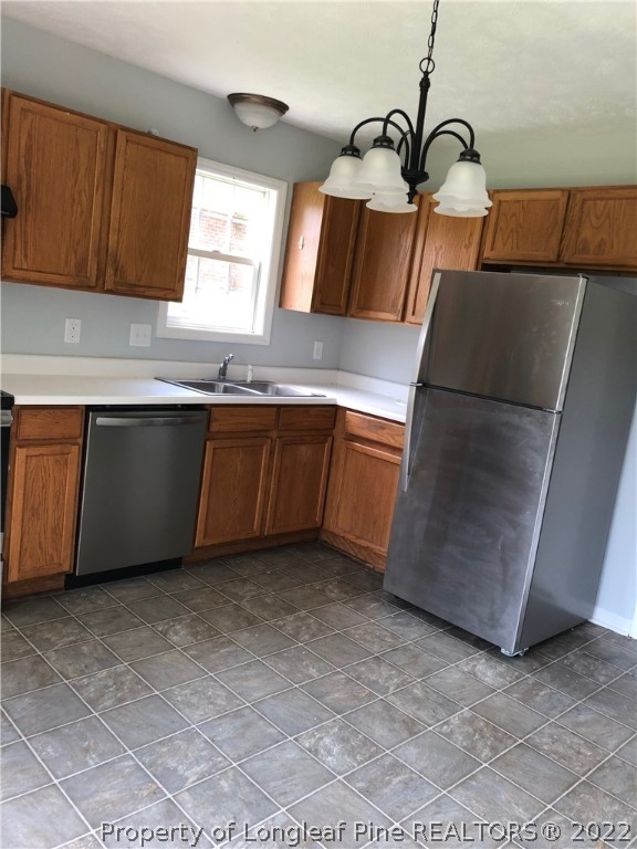 450 Main Street Lillington, NC 27546 - Photo 6 of 11 a kitchen with granite countertop a sink and a stove