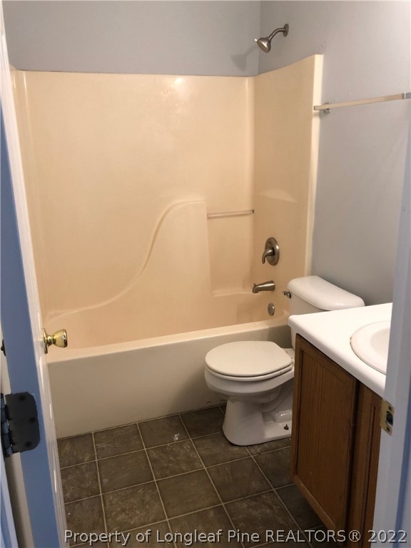 450 Main Street Lillington, NC 27546 - Photo 8 of 11 a bathroom with a toilet a sink and bathtub