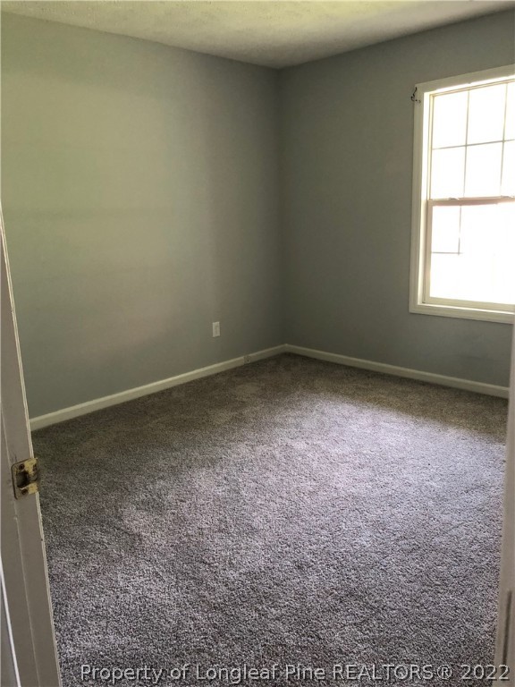 450 Main Street Lillington, NC 27546 - Photo 9 of 11 an empty room with a window