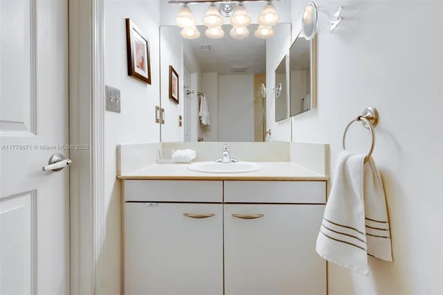 a bathroom with a sink and mirror