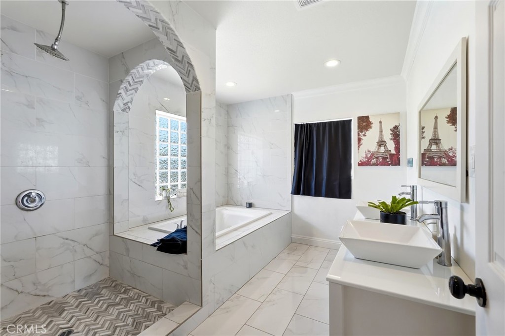 8630 Sharp Avenue Sun Valley, CA 91352 - Photo 27 of 62 a bathroom with a tub shower and sink