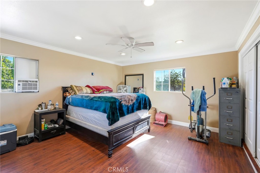 8630 Sharp Avenue Sun Valley, CA 91352 - Photo 29 of 62 a bedroom with bed and wooden floor