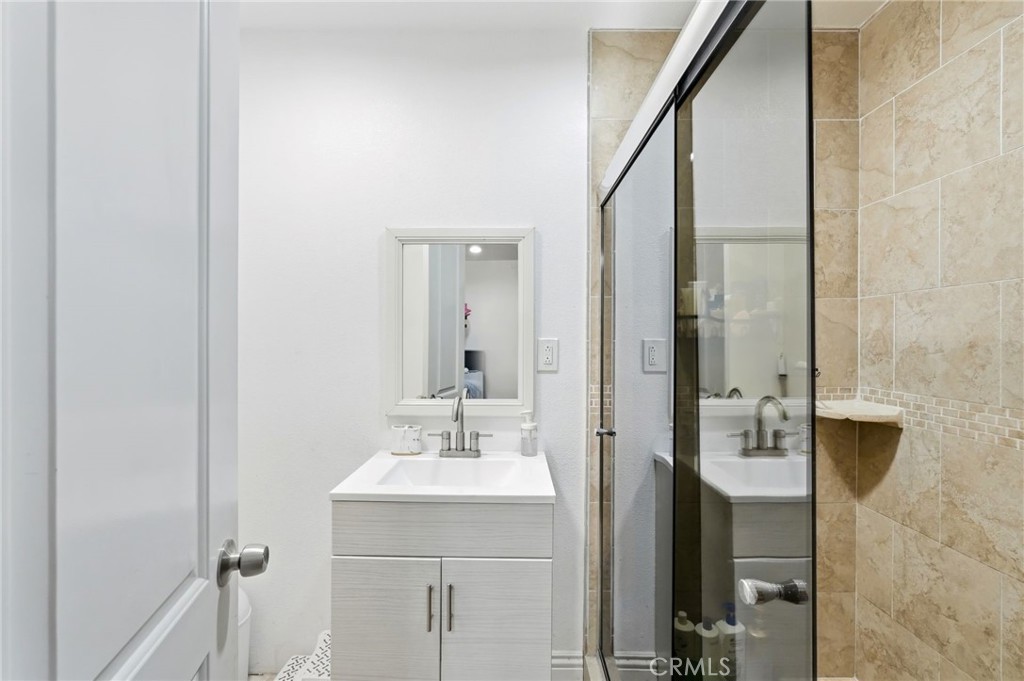 8630 Sharp Avenue Sun Valley, CA 91352 - Photo 33 of 62 a bathroom with a sink and a mirror